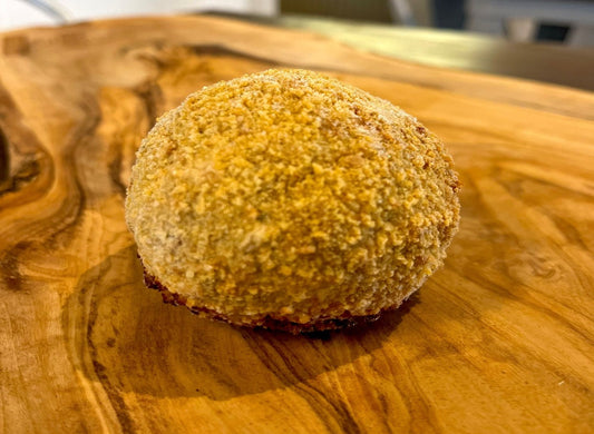 Hard boiled egg encased in Cumberland sausage meat, rolled in fine breadcrumbs and baked to perfection