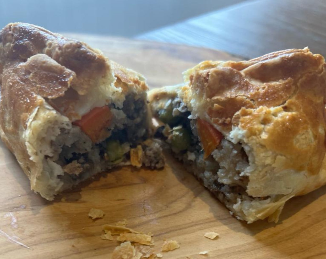 An authentic Cornish Pasty cooked to perfection and cut in half