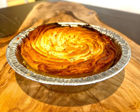 Traditional Shepherds pie made with ground lamb,beans,mushrooms,carrots,onions & tomatoes topped with truffle oil infused mash. cooked to perfection