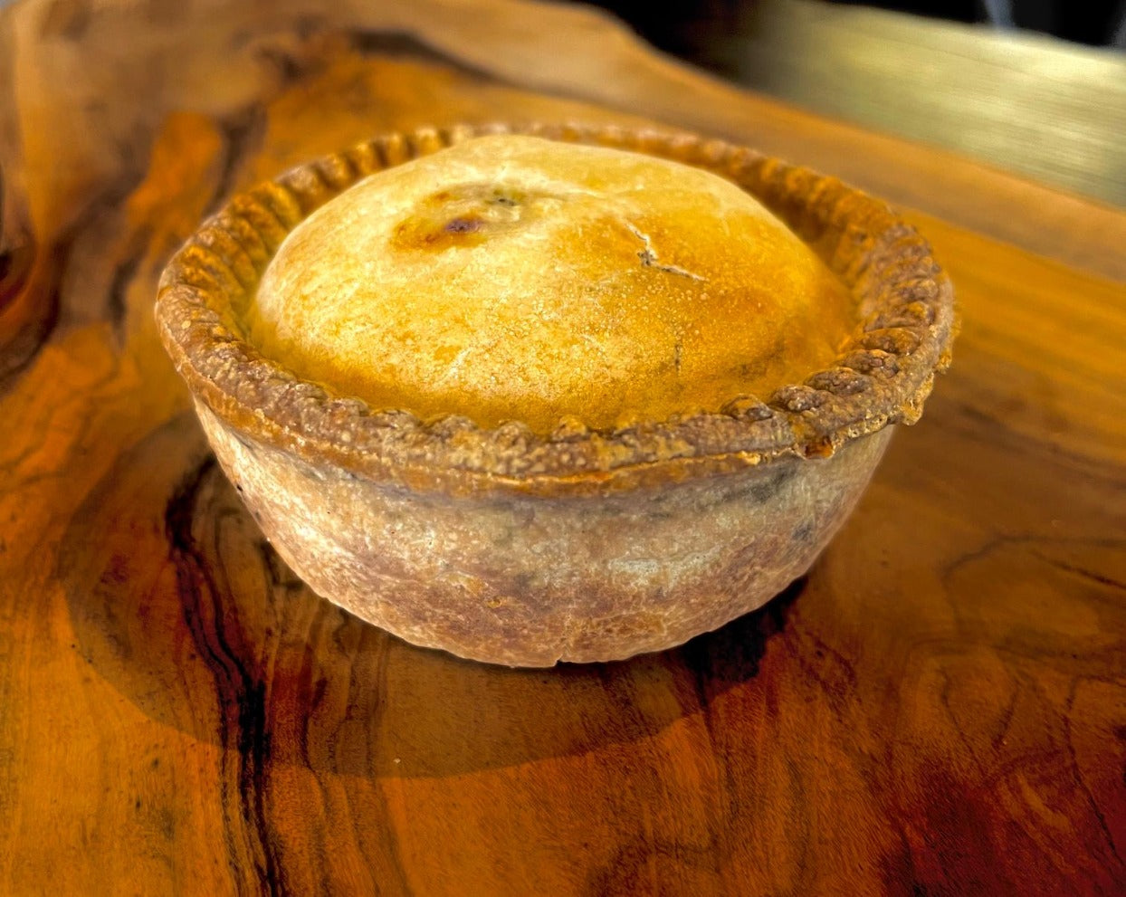 A well-made authentic British Chicken & Mushroom Pie