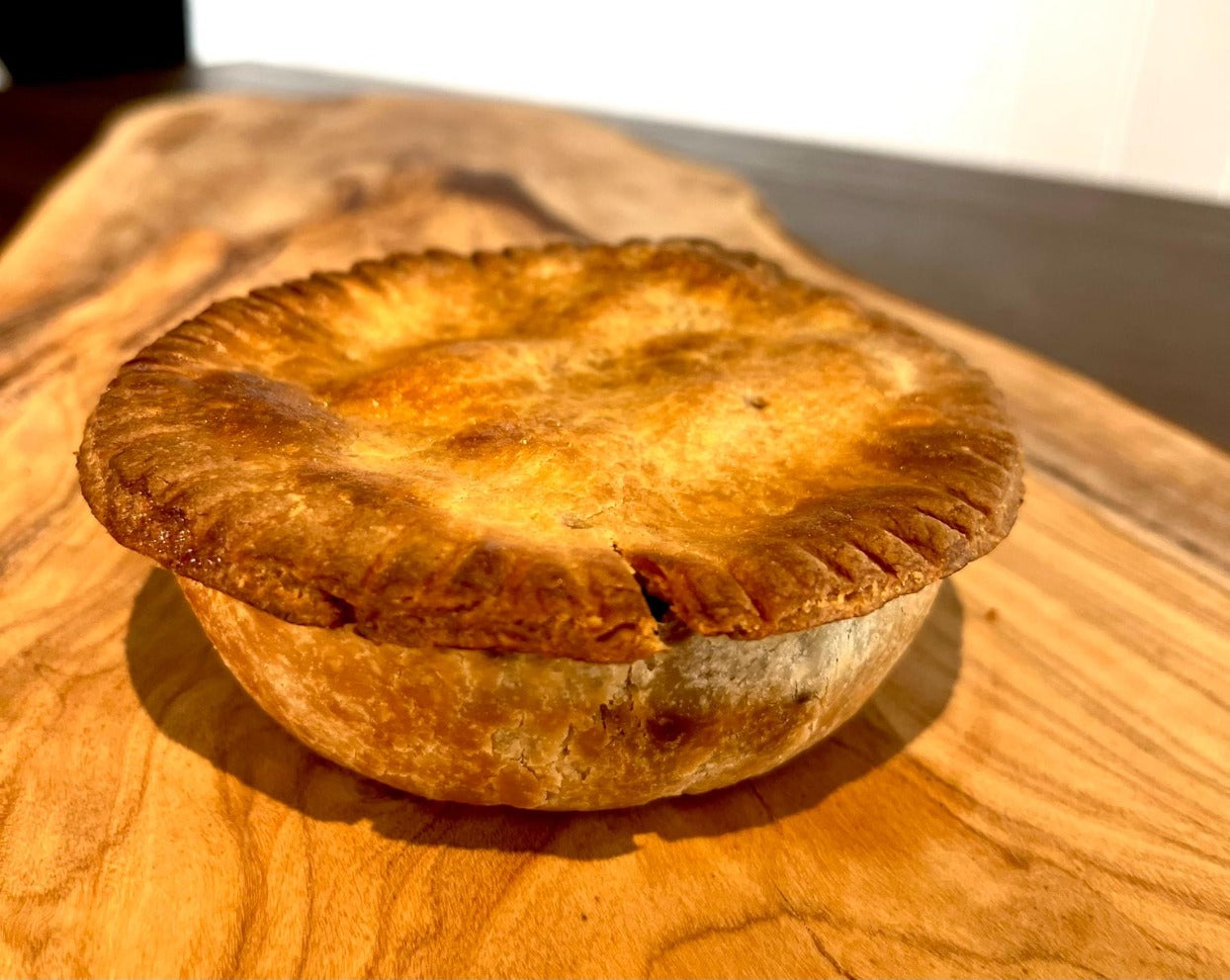 Fork tender beef chunks and sautéed onions in a rich ale-based gravy, encased in a shortcrust pastry