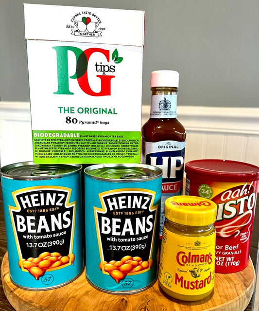 a selection of british pantry essentials including; pg tips tea bags, hp brown sauce, heinz baked beans, colmans english mustard and bisto gravy granules